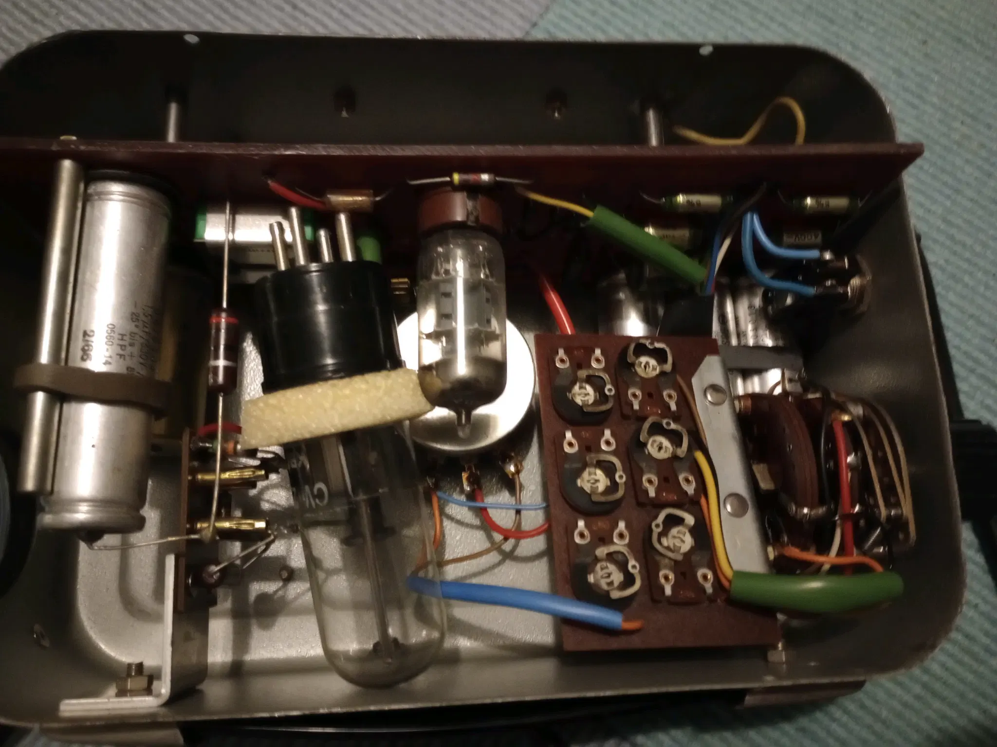 picture of an open case of a stroboscope, with various parts visible