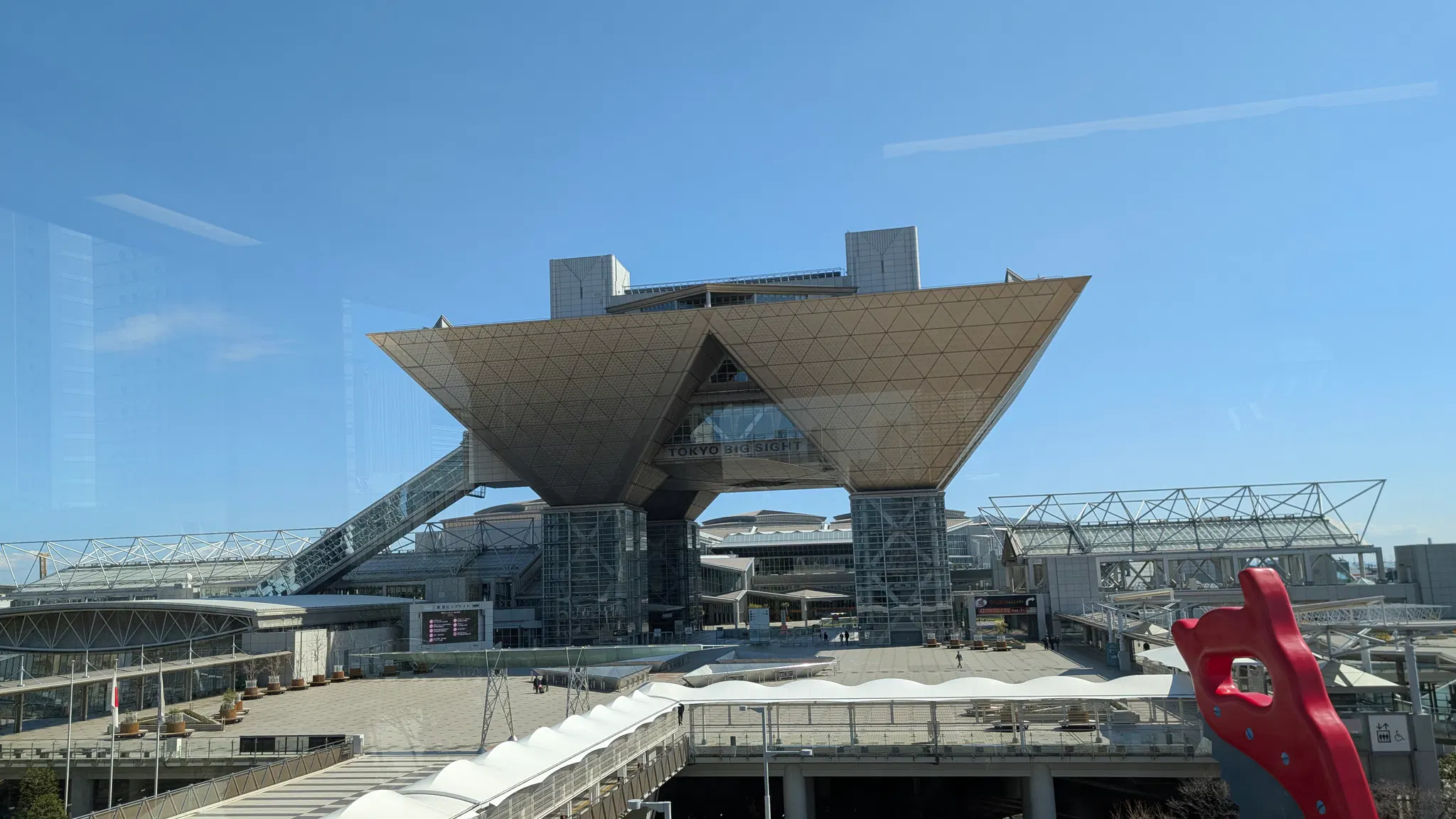 A photo of the Tokyo Big Site convention center seen from a train.